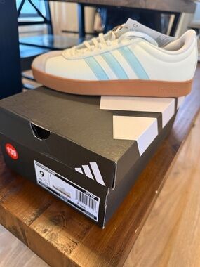 adidas Women’s White Sneakers with Light Blue Stripes and Gum Sole